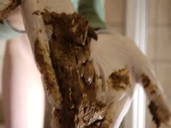 Girl collects her smelly shit using her hands with gloves